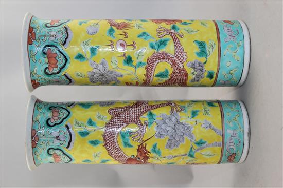 A pair of Chinese famille rose yellow ground sleeve vases, Kangxi mark, late 19th century, 26cm